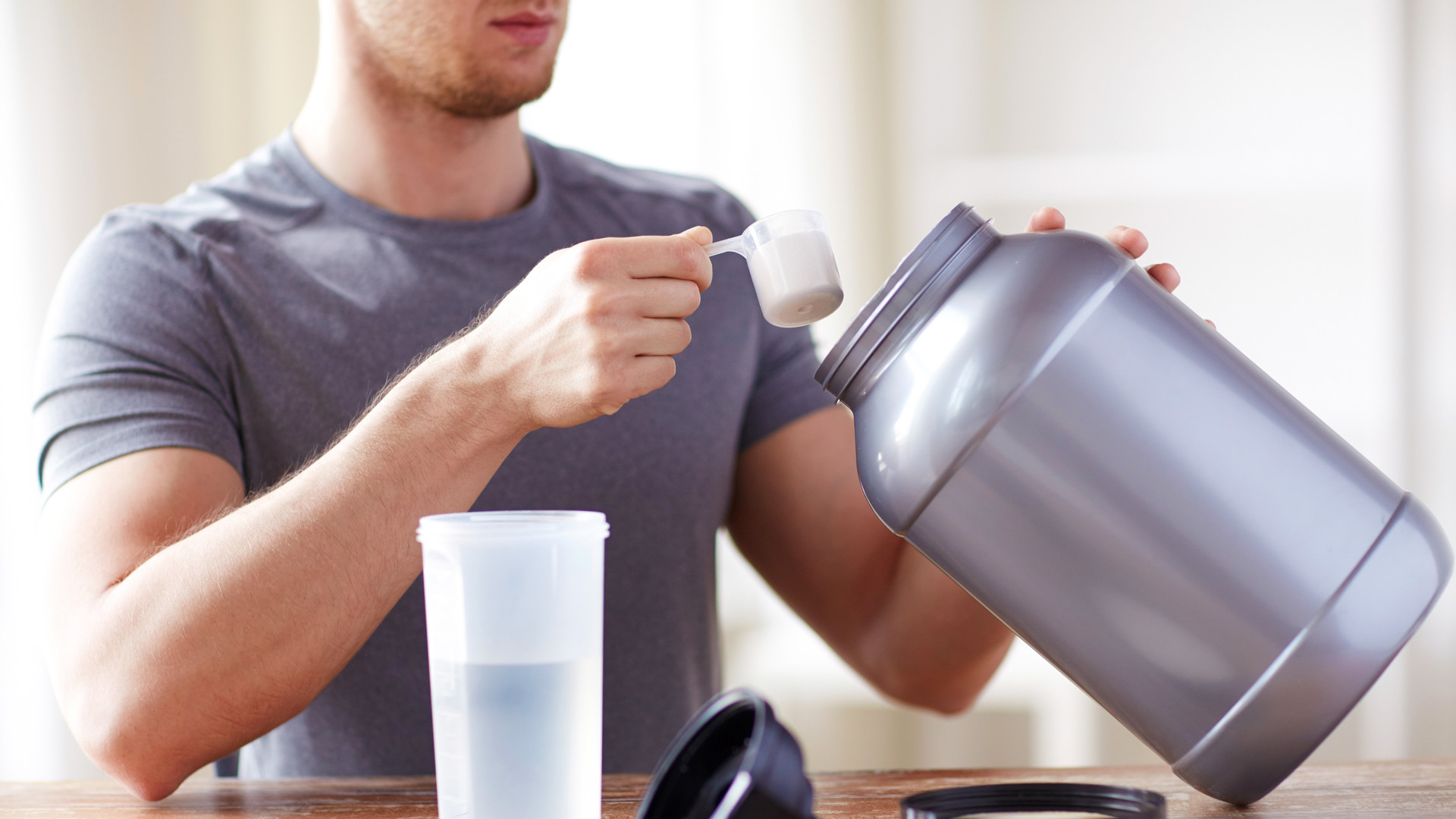 Man mixing water with supplement